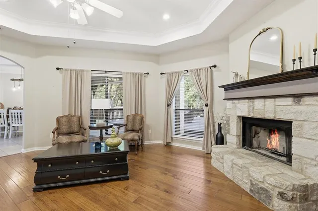 a living room with furniture and a fireplace