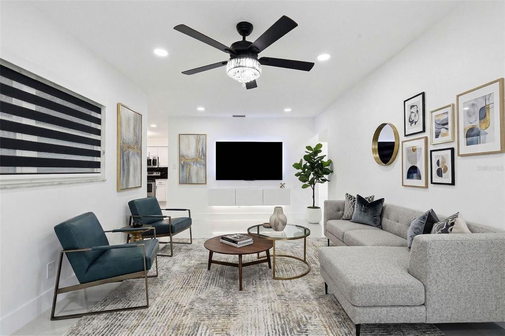 3216 West Beach Street Tampa, FL 33607 - Photo 12 of 63 a living room with furniture and a flat screen tv