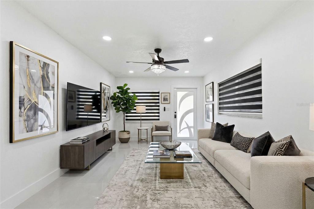 3216 West Beach Street Tampa, FL 33607 - Photo 15 of 63 a living room with furniture and flat screen tv