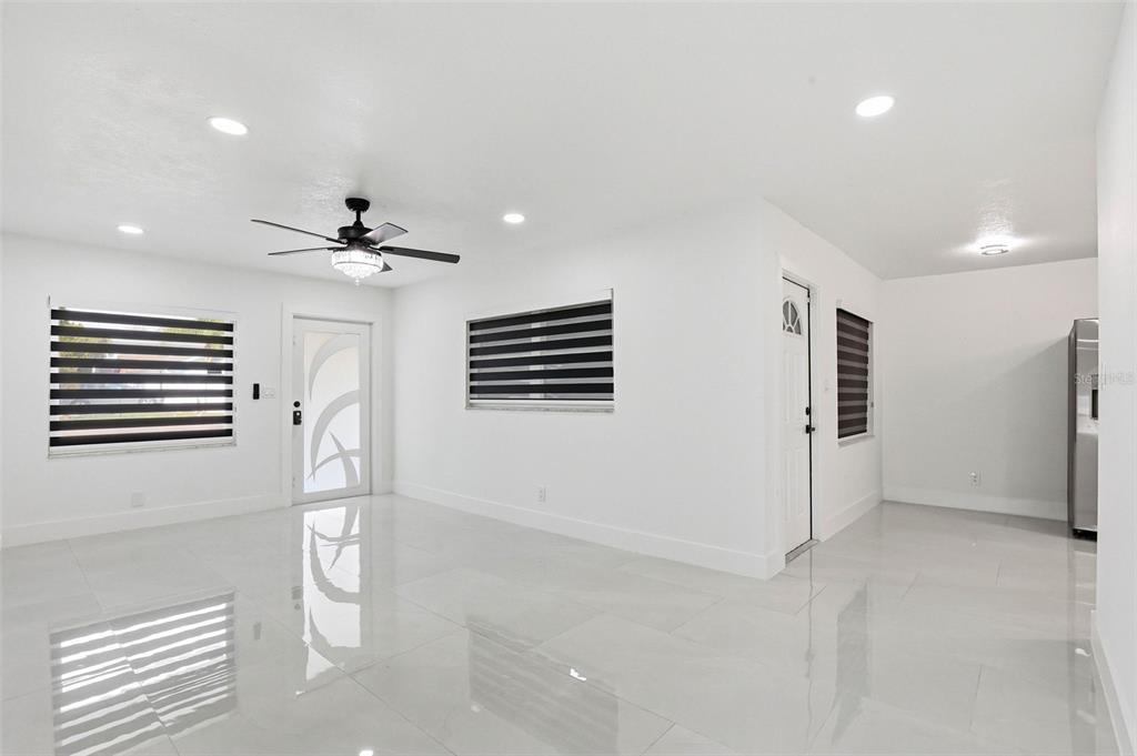 3216 West Beach Street Tampa, FL 33607 - Photo 16 of 63 a view of a livingroom with a ceiling fan and window