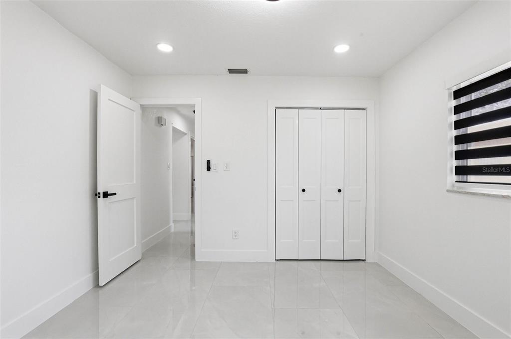 3216 West Beach Street Tampa, FL 33607 - Photo 20 of 63 a view of an empty room with closet and a window