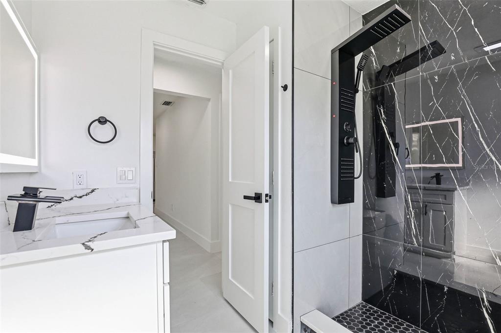 3216 West Beach Street Tampa, FL 33607 - Photo 24 of 63 a bathroom with a sink toilet and shower