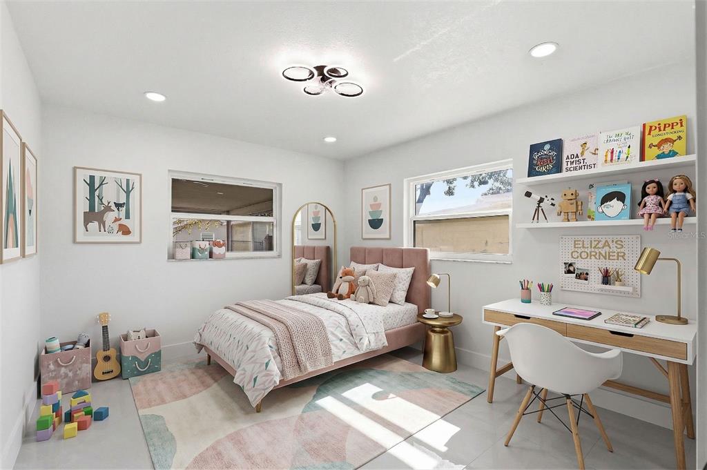 3216 West Beach Street Tampa, FL 33607 - Photo 35 of 63 a bedroom with a bed a books bucket with a desk and chair