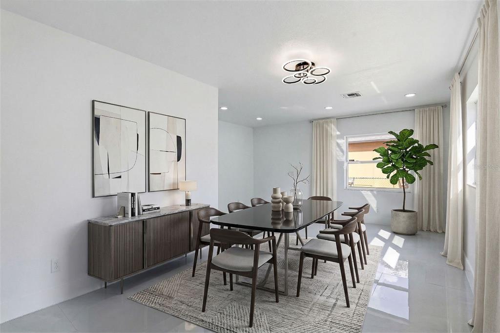 3216 West Beach Street Tampa, FL 33607 - Photo 50 of 63 a view of a dining room with furniture and a potted plant
