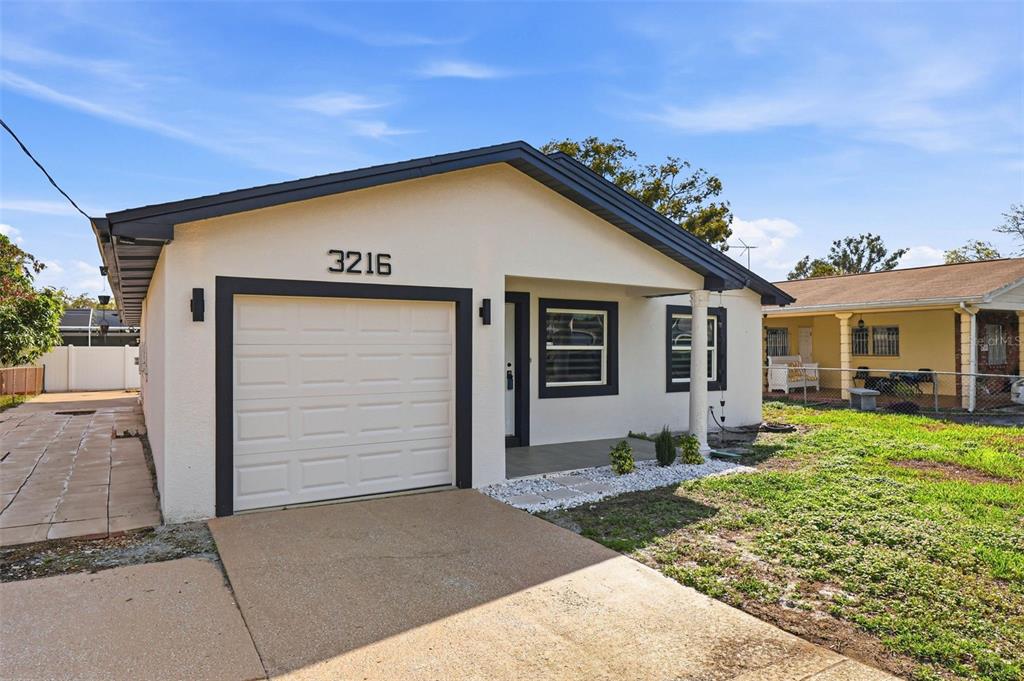 3216 West Beach Street Tampa, FL 33607 - Photo 6 of 63 a view of a house with a yard