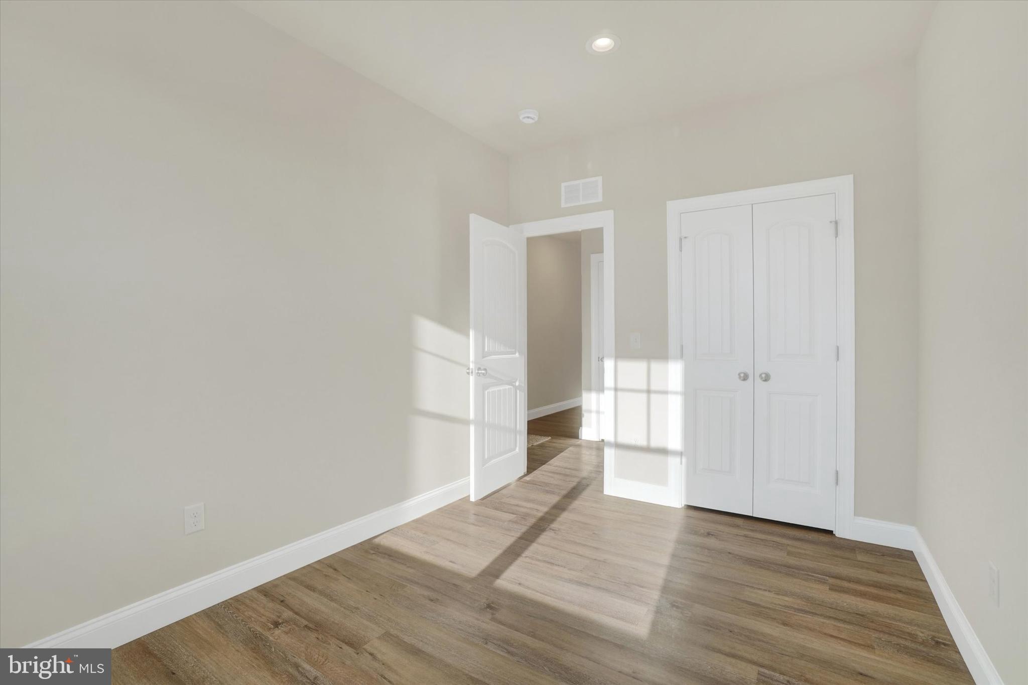 145 Eli Drive York, PA 17404 - Photo 6 of 20 a view of an empty room with wooden floor