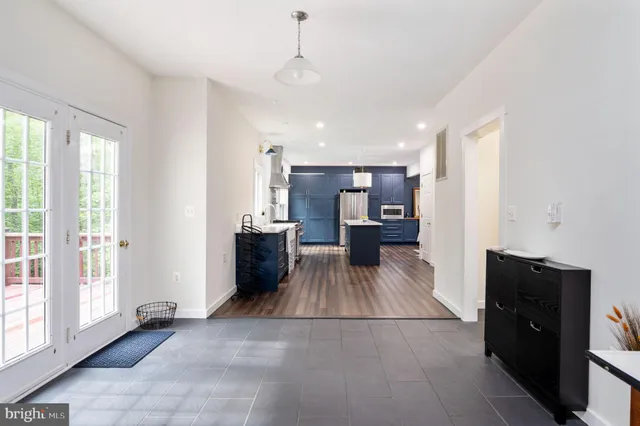a view of a livingroom with a fireplace and window