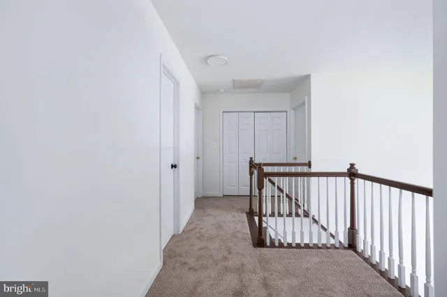 a bathroom with a double vanity sink a mirror and a shower