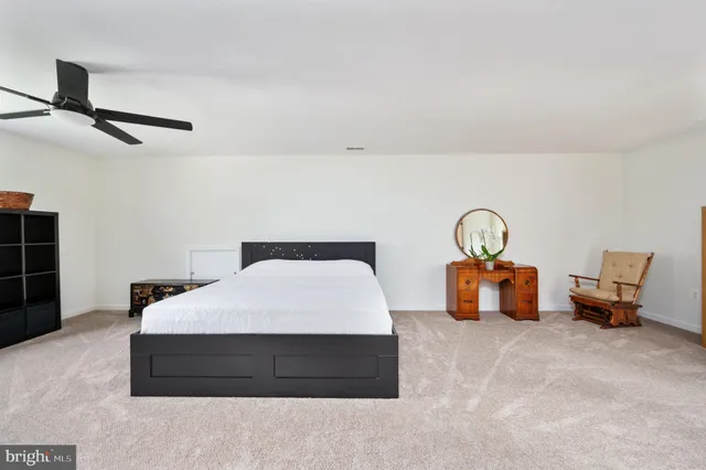 a bathroom with a granite countertop sink a mirror and a bathtub