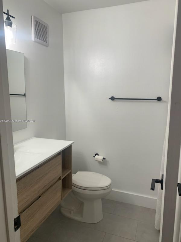 4590 Southwest 68th Ct Circle, Unit 4 Miami, FL 33155 - Photo 18 of 32 a bathroom with a sink a toilet and vanity