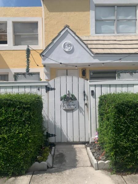 4590 Southwest 68th Ct Circle, Unit 4 Miami, FL 33155 - Photo 27 of 32 a view of a small house with potted plants