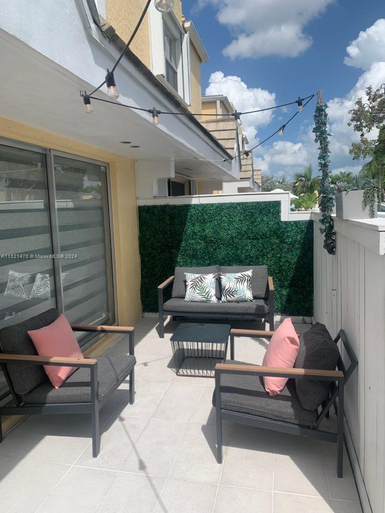 4590 Southwest 68th Ct Circle, Unit 4 Miami, FL 33155 - Photo 32 of 32 a outdoor space with a couch