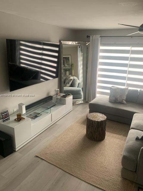 4590 Southwest 68th Ct Circle, Unit 4 Miami, FL 33155 - Photo 6 of 32 a living room with furniture and a flat screen tv