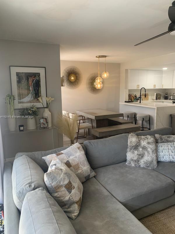 4590 Southwest 68th Ct Circle, Unit 4 Miami, FL 33155 - Photo 7 of 32 a living room with furniture and a wooden floor