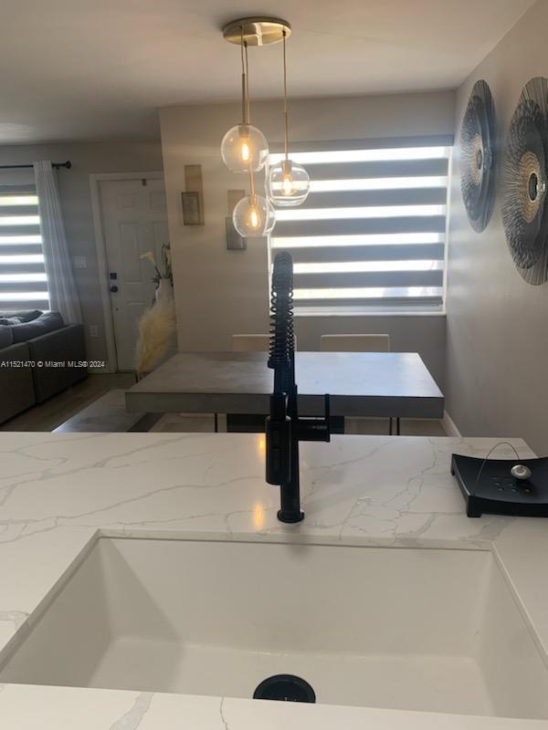 4590 Southwest 68th Ct Circle, Unit 4 Miami, FL 33155 - Photo 9 of 32 a bathroom with a sink and a mirror