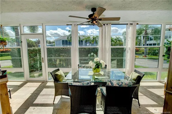 a view of a dining room with furniture window and outside view