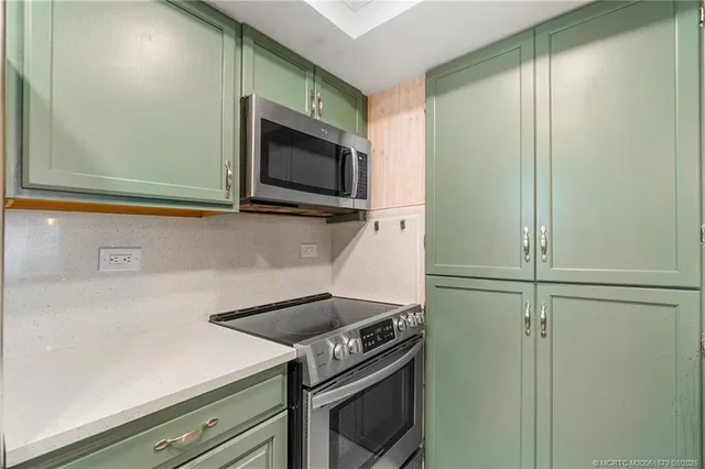 a kitchen with a stove and a microwave