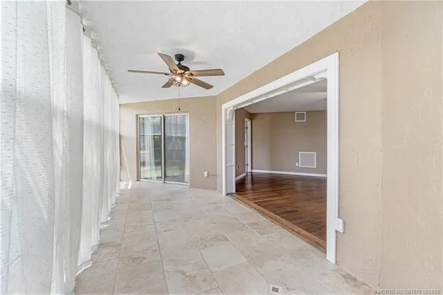 a view of livingroom with hardwood floor and a ceiling fan