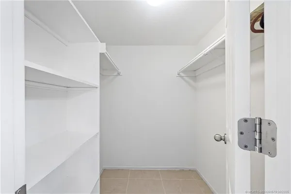 a view of staircase with white walls