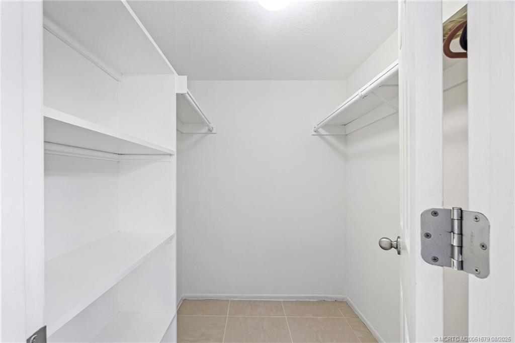 3218 Southeast Aster Lane, Unit P116 Stuart, FL 34994 - Photo 39 of 45 a view of staircase with white walls