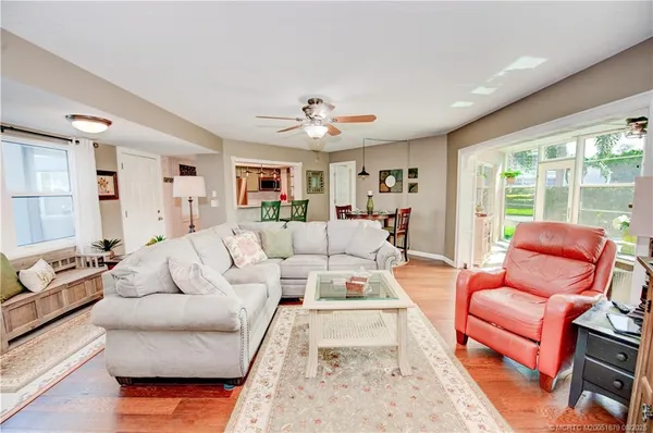 a living room with furniture or couch and a large window
