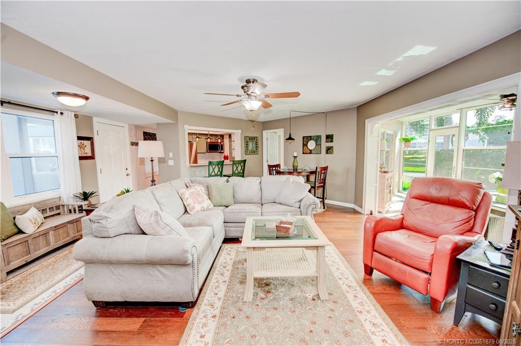 3218 Southeast Aster Lane, Unit P116 Stuart, FL 34994 - Photo 8 of 45 a living room with furniture or couch and a large window