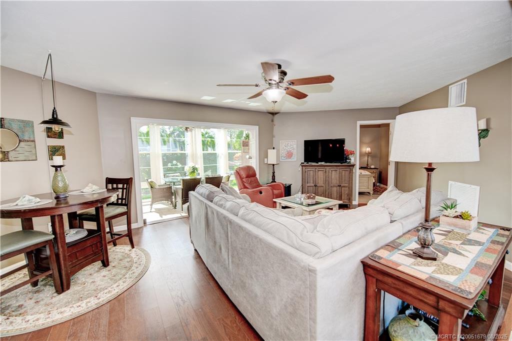 3218 Southeast Aster Lane, Unit P116 Stuart, FL 34994 - Photo 9 of 45 a view of a workspace with furniture and a flat screen tv