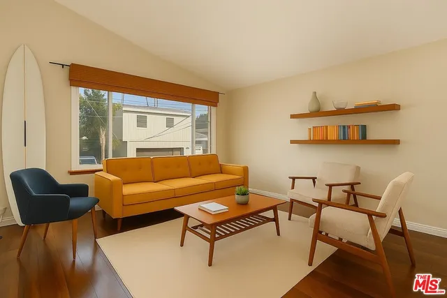 a view of a dining room with furniture and window