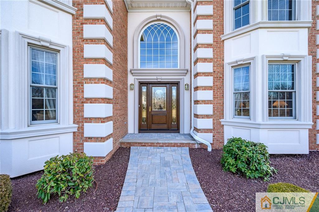 3 Victoria Court Cream Ridge, NJ 08514 - Photo 2 of 38 a front view of a house with garden