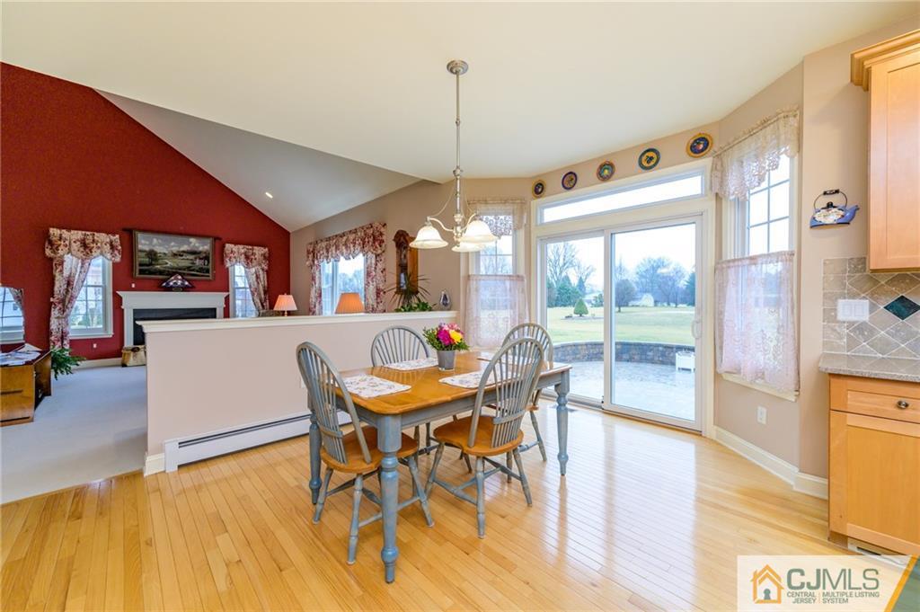 3 Victoria Court Cream Ridge, NJ 08514 - Photo 12 of 38 a dining room with furniture a chandelier and wooden floor