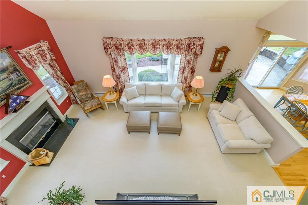 3 Victoria Court Cream Ridge, NJ 08514 - Photo 15 of 38 a living room with furniture and a flat screen tv