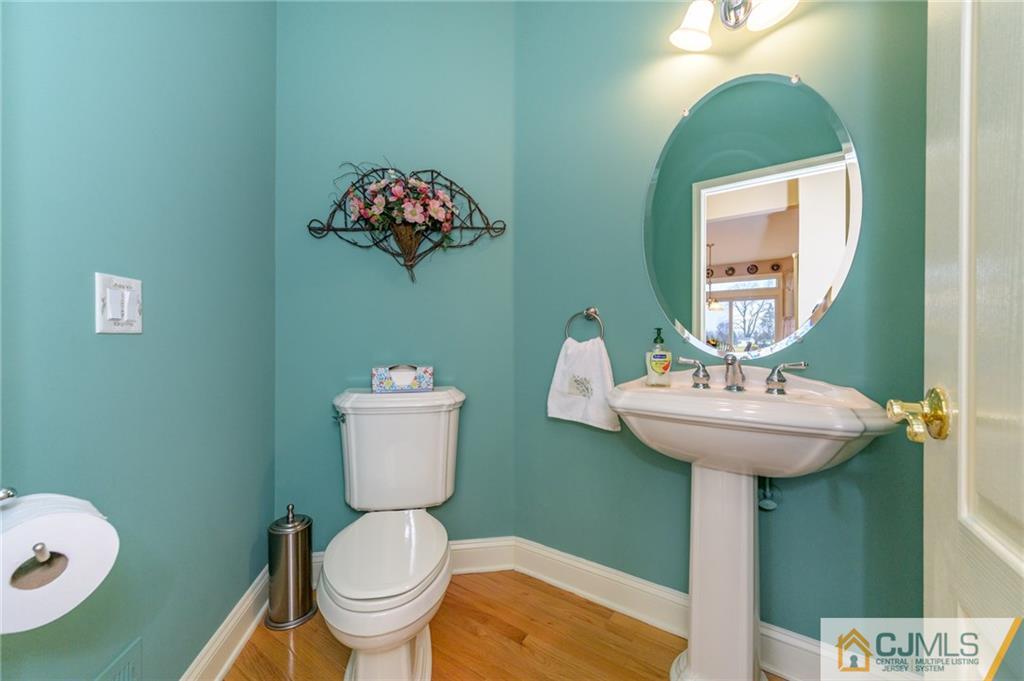 3 Victoria Court Cream Ridge, NJ 08514 - Photo 18 of 38 a bathroom with a toilet sink and mirror