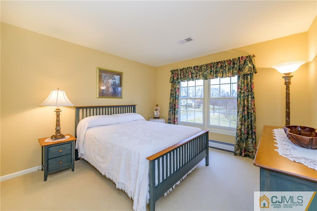3 Victoria Court Cream Ridge, NJ 08514 - Photo 21 of 38 a bedroom with a bed and a window