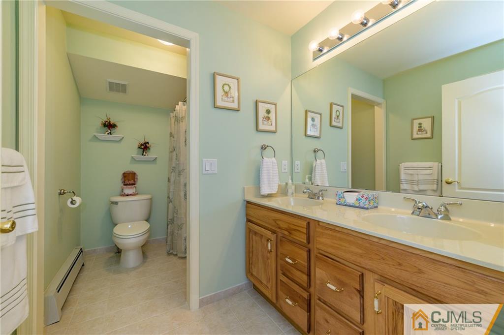 3 Victoria Court Cream Ridge, NJ 08514 - Photo 25 of 38 a spacious bathroom with a granite countertop sink toilet and shower
