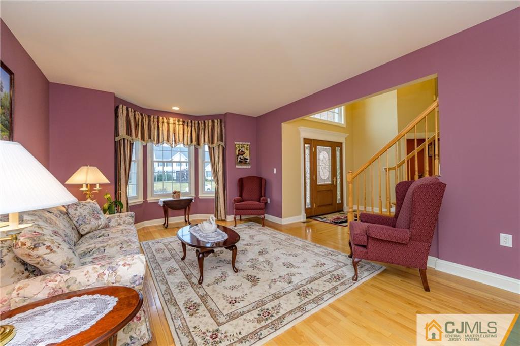 3 Victoria Court Cream Ridge, NJ 08514 - Photo 4 of 38 a living room with furniture and a fireplace