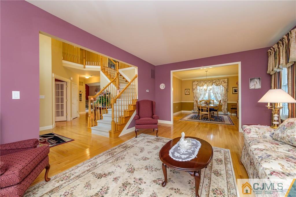 3 Victoria Court Cream Ridge, NJ 08514 - Photo 6 of 38 a living room with furniture and a table