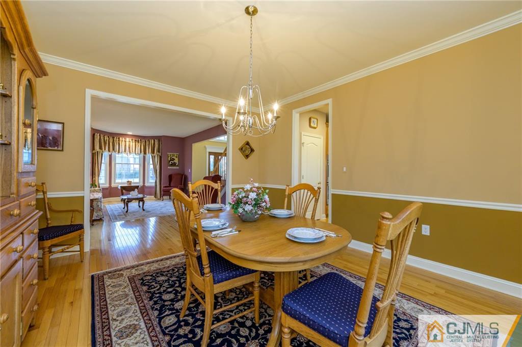 3 Victoria Court Cream Ridge, NJ 08514 - Photo 7 of 38 a view of a dining room with furniture and chandelier