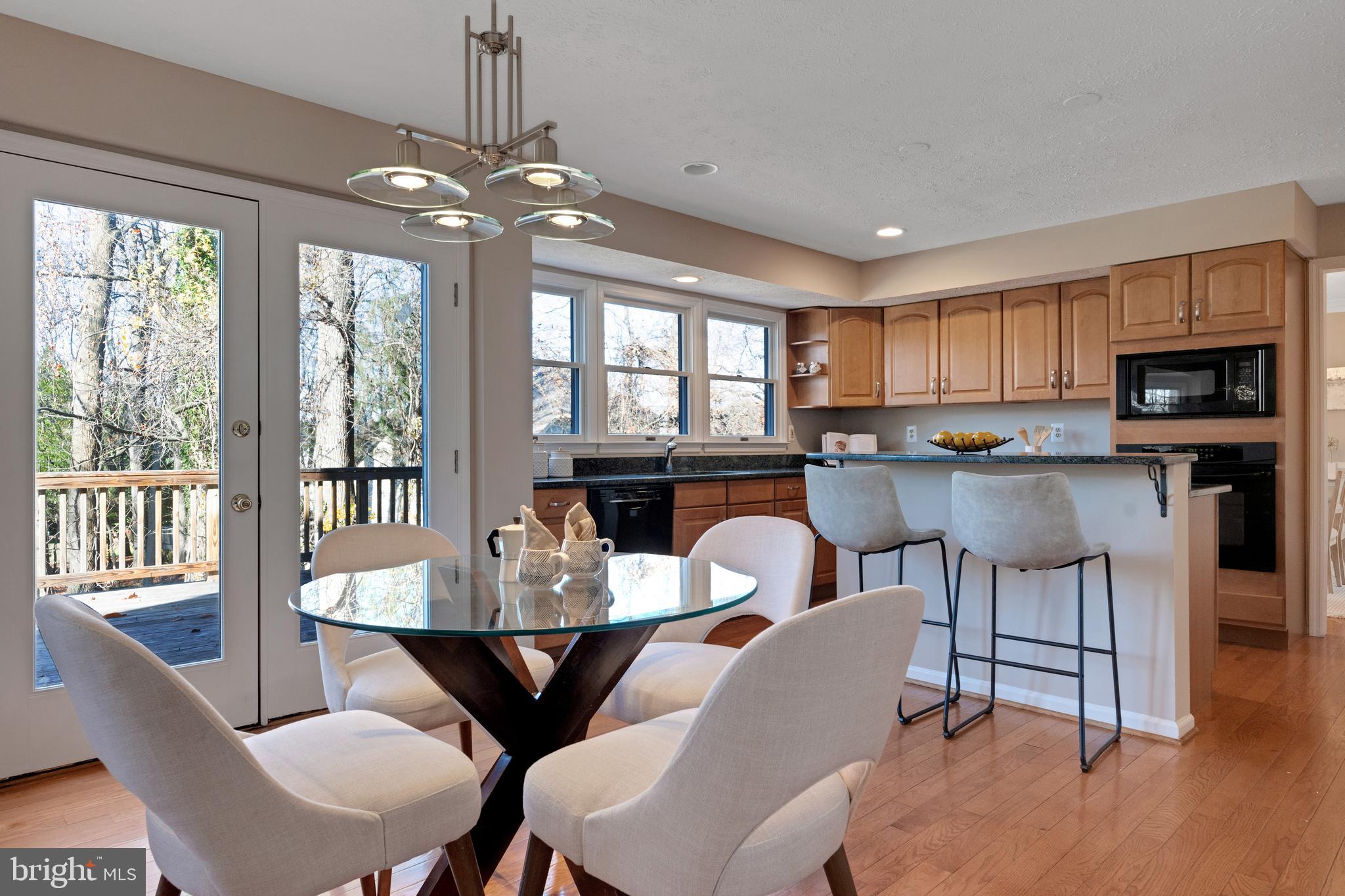 13472 Bregman Road Silver Spring, MD 20904 - Photo 9 of 32 Kitchen table space leads to the deck