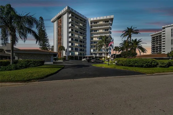 a front view of a building with garden