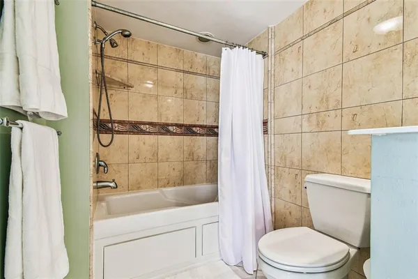 a room with lots of furniture and a large window