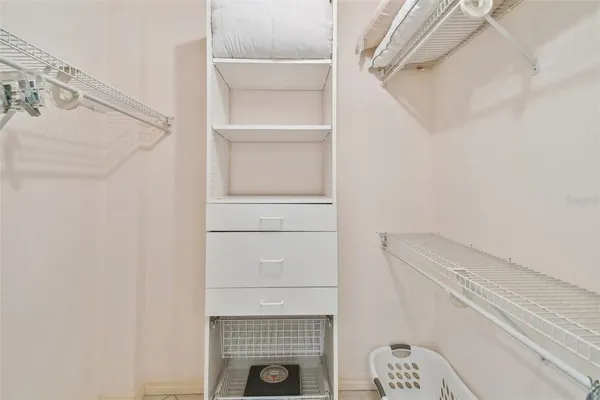 a view of swimming pool with a yard and plants