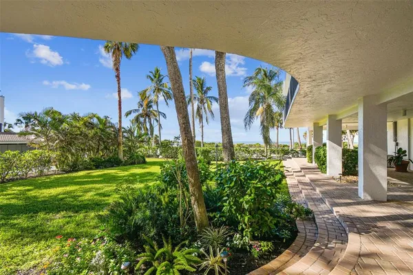 an aerial view of a city with ocean view in back