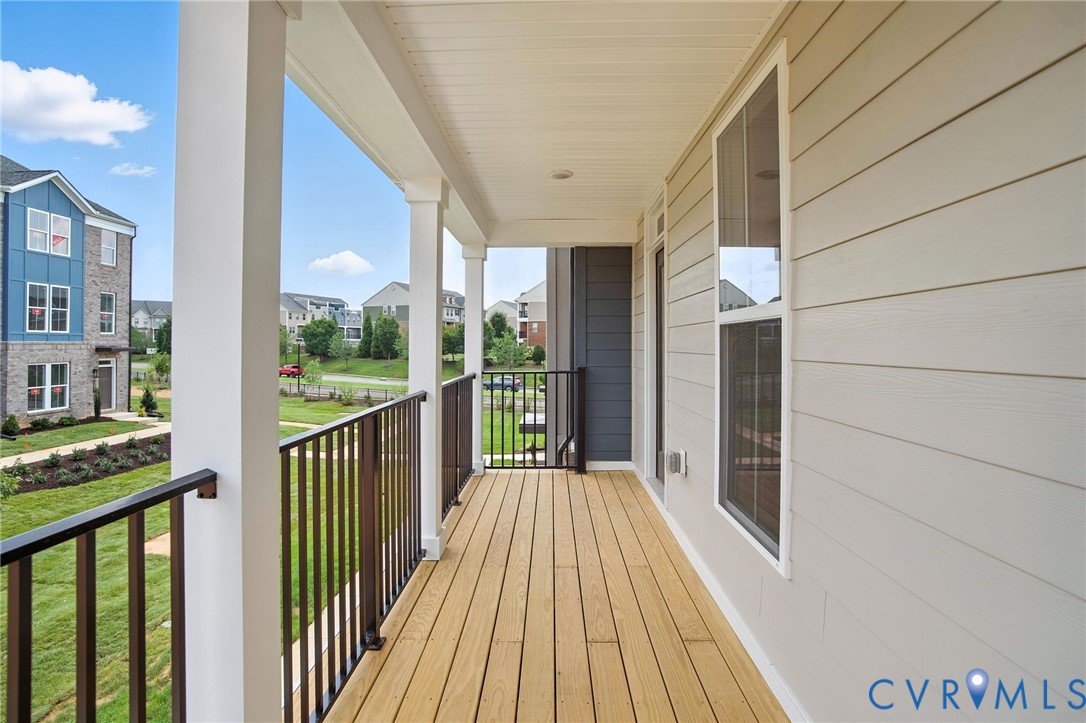 11927 Evening Loop Henrico, VA 23233 - Photo 16 of 37 a view of a balcony with wooden floor