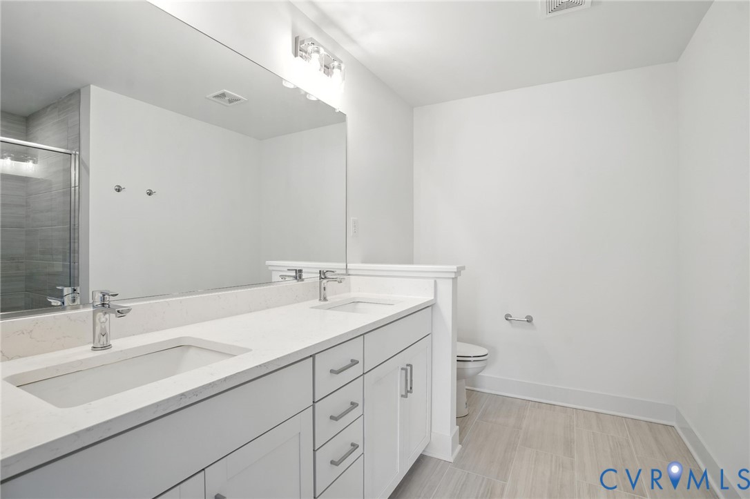 11927 Evening Loop Henrico, VA 23233 - Photo 19 of 37 a bathroom with a sink and a toilet
