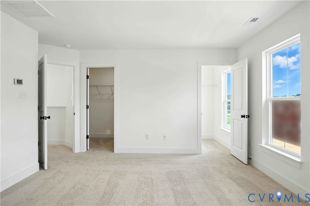 11927 Evening Loop Henrico, VA 23233 - Photo 5 of 37 an empty room with windows and closet