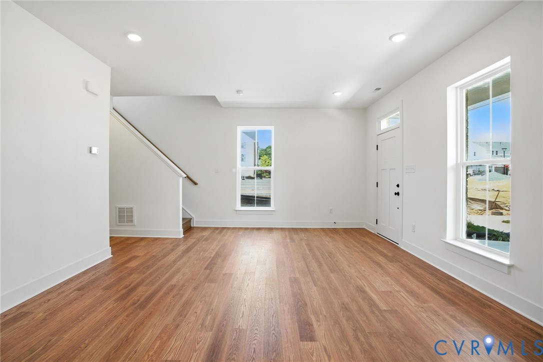 11927 Evening Loop Henrico, VA 23233 - Photo 7 of 37 wooden floor in an empty room with a window