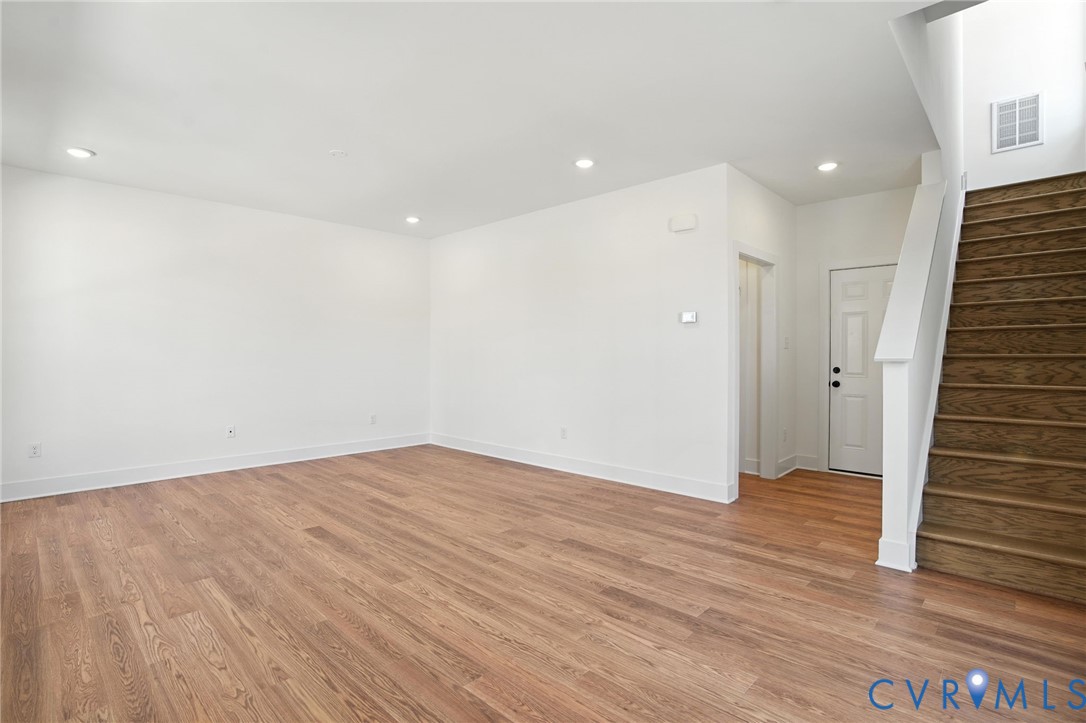11927 Evening Loop Henrico, VA 23233 - Photo 10 of 37 an empty room with wooden floor and entryway