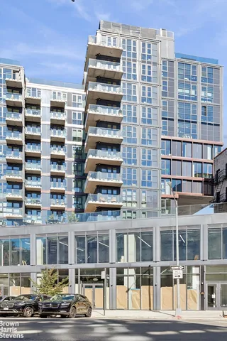 a view of living room with furniture and wooden floor