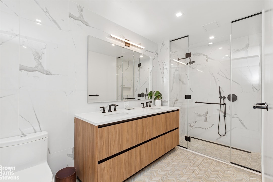 11 Hancock Place, Unit PH206 Manhattan, NY 10027 - Photo 6 of 14 a bathroom with a sink a toilet and shower