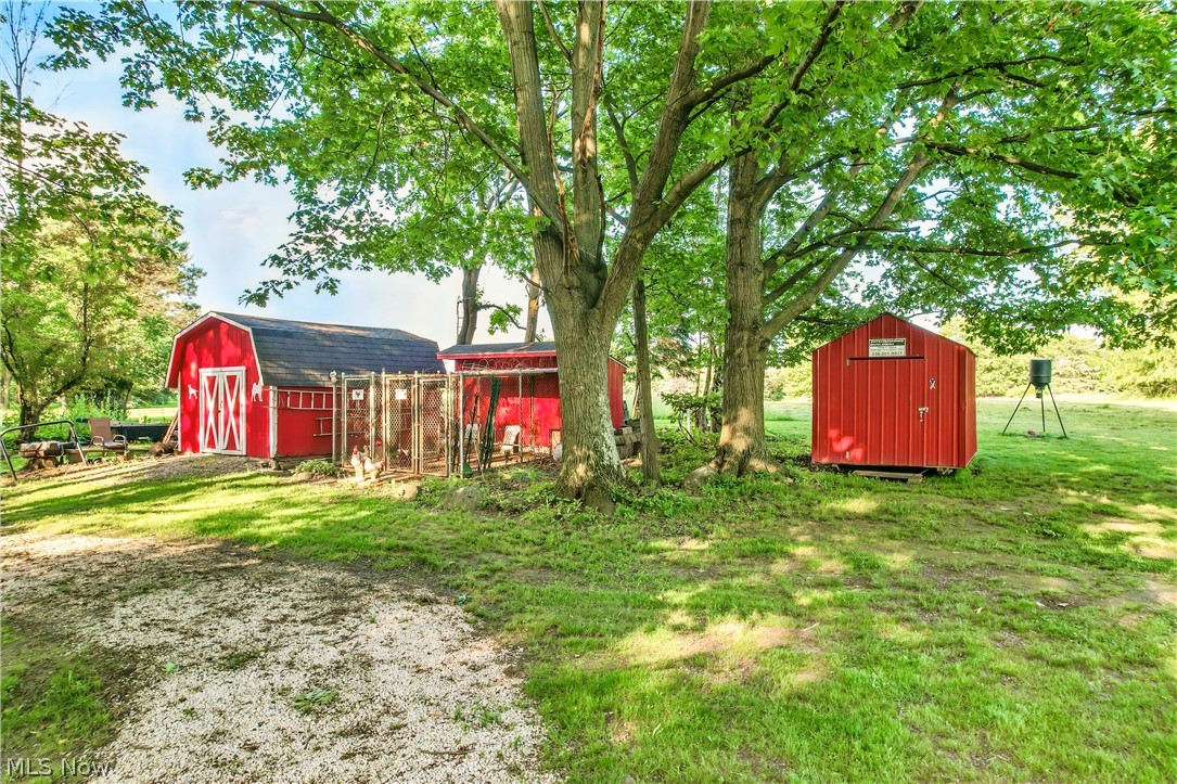 2717 Niles Vienna Road Niles, OH 44446 - Photo 48 of 50 View of grassy yard featuring a storage unit